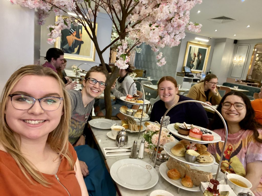 Afternoon tea in South Kensington. Seated at the front table are Ally, Aimee, Grace F, and Jaden.